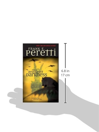 This Present Darkness by Frank E. Peretti
