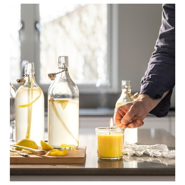 IKEA Blodhagg scented candle in glass lemon lemongrass yellow